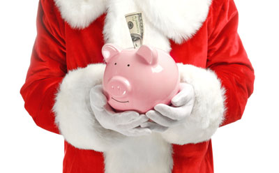 santa holding piggy bank